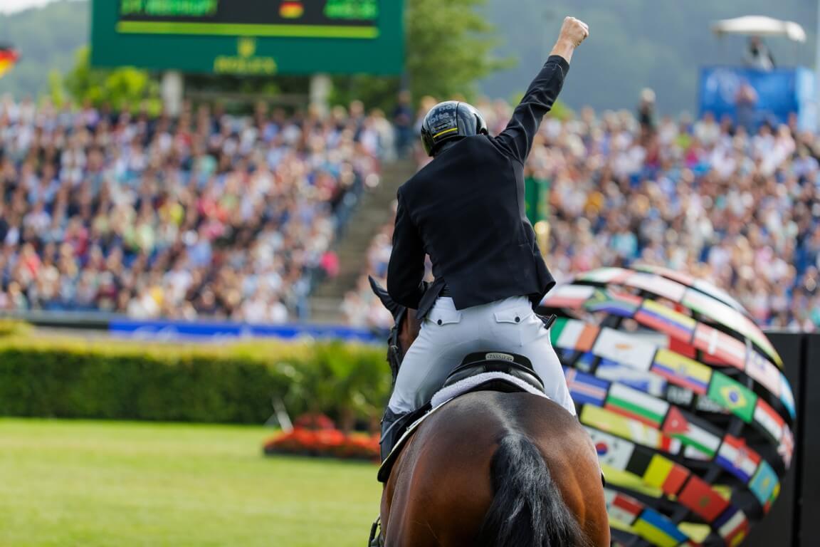 Person cheering on horse
